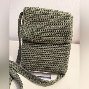 The SAK green woven crochet crossbody purse bag